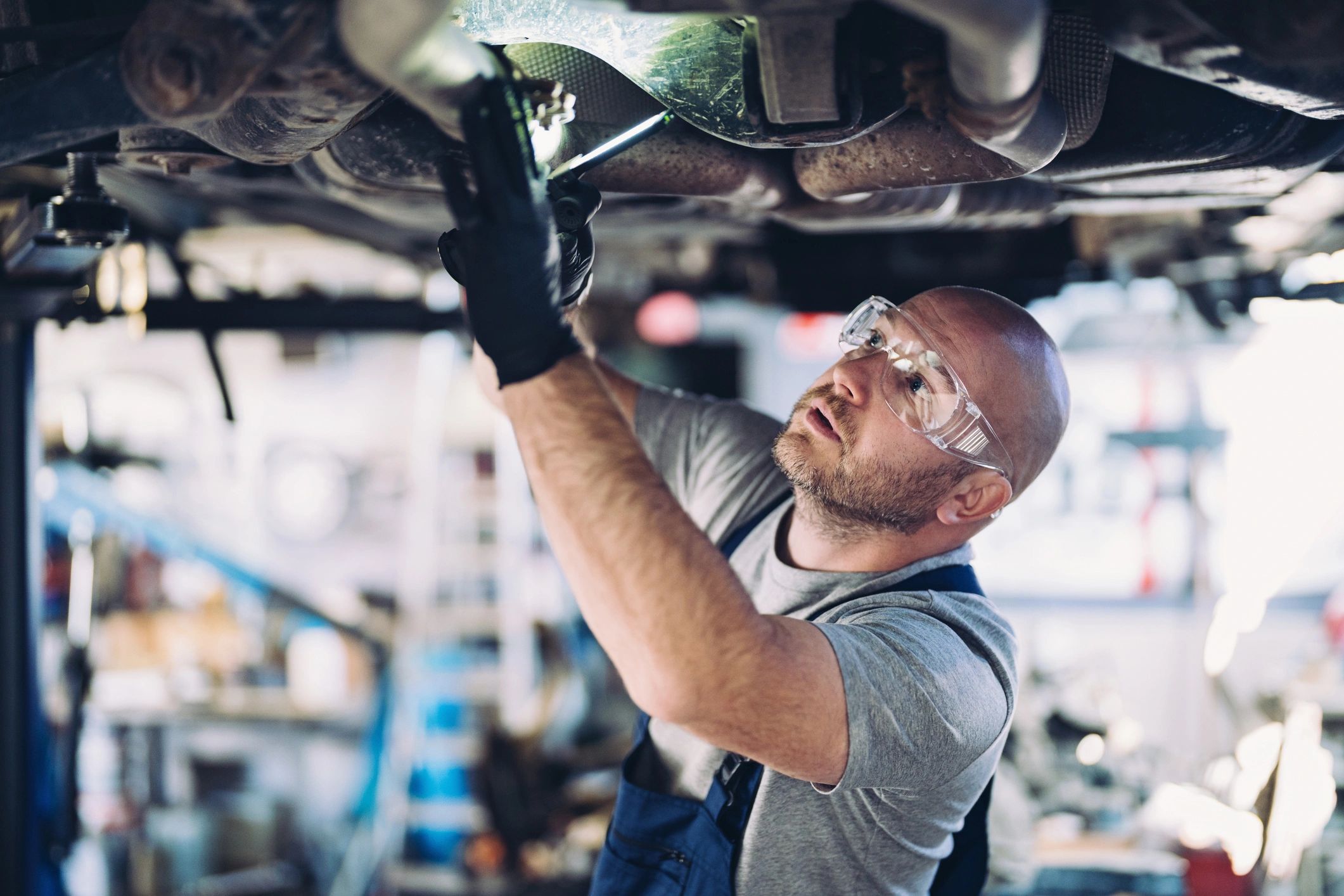auto mechanic working on car